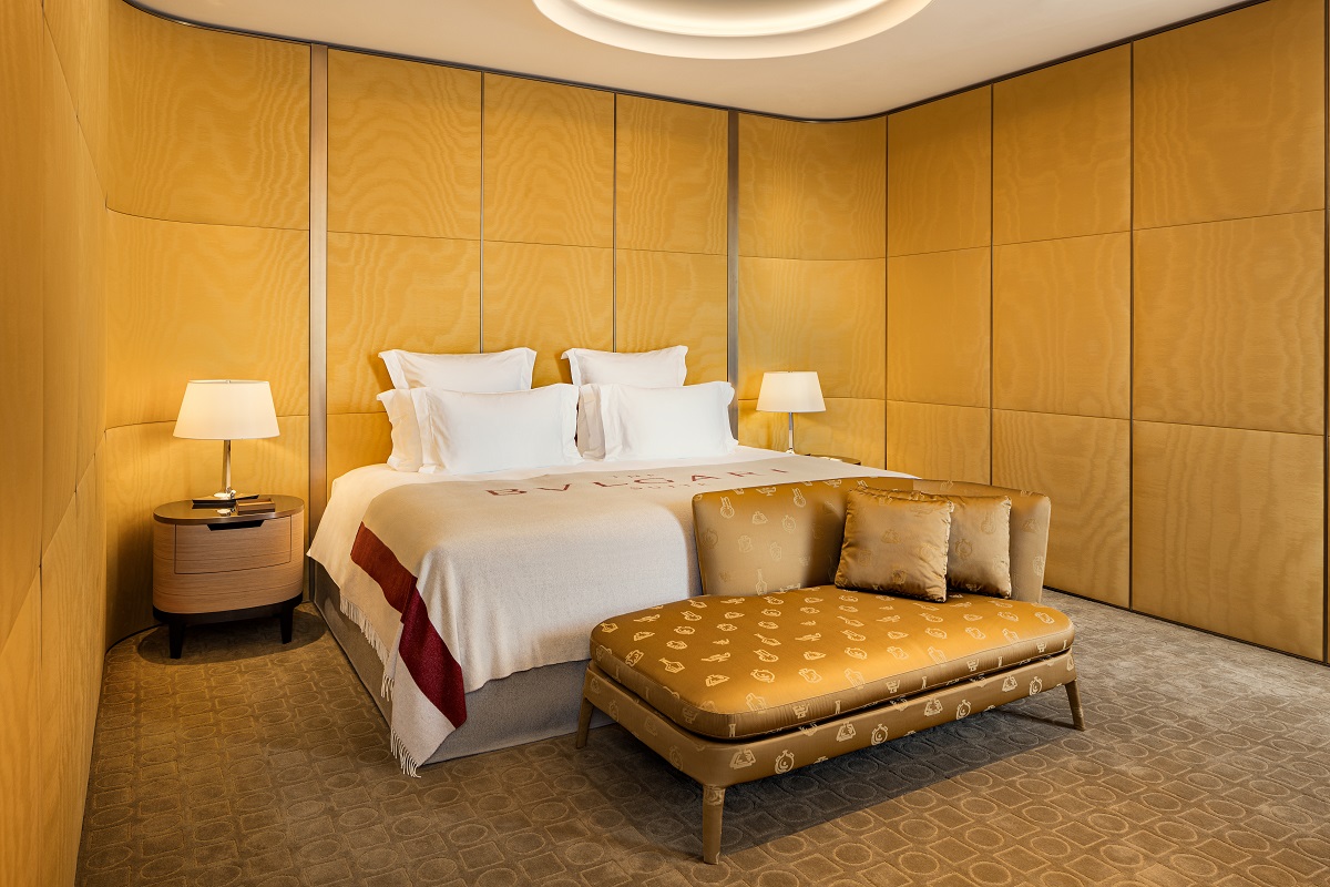 Bulgari suite bedroom in gold and brown with bulgari blanket