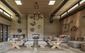 x frame chairs in wood with plaster walls and natural materials on walls in the Tierra Luna Spa Arizona Biltmore Waldorf Astoria