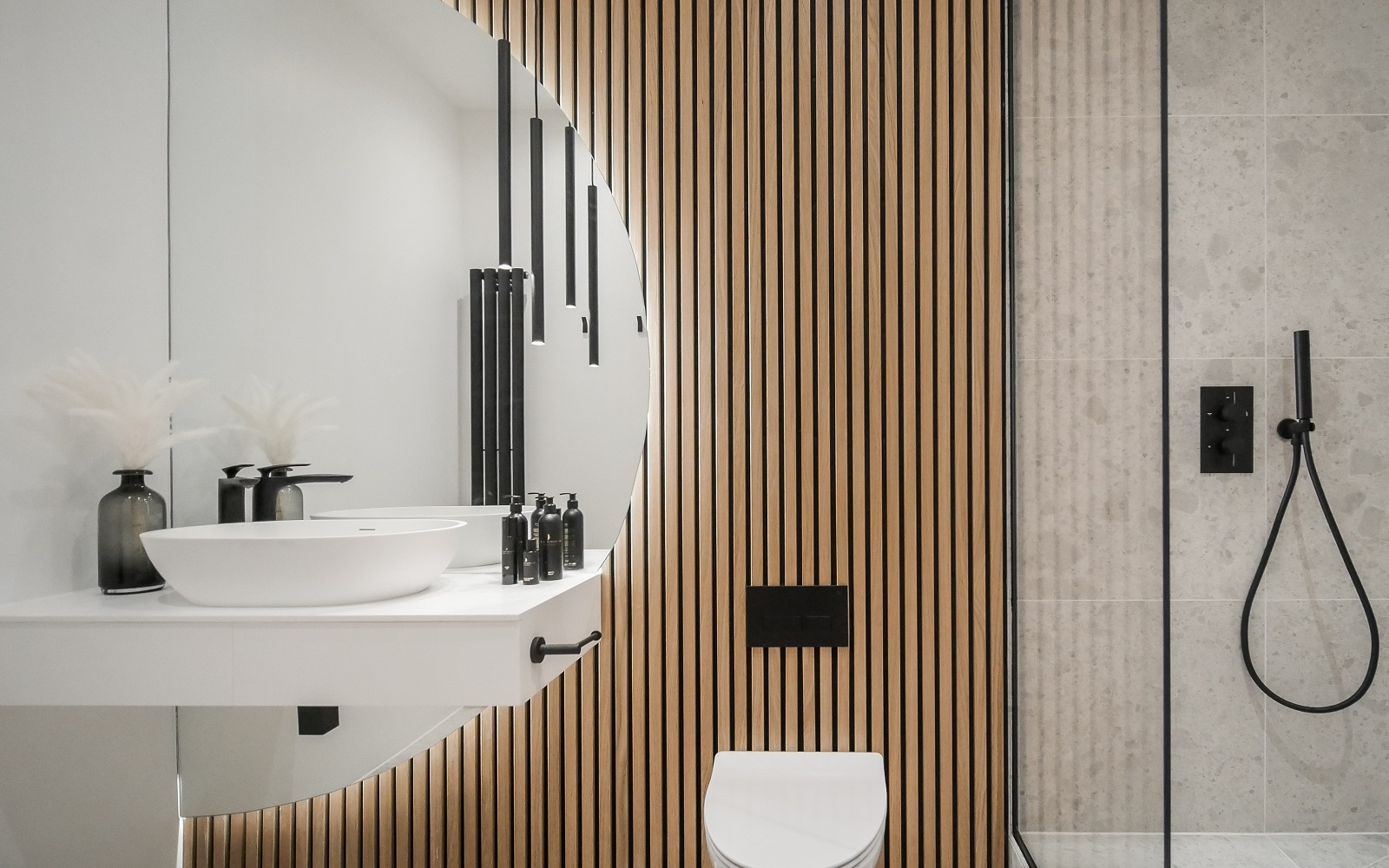 zen inspired bathroom in white and natural wood with circular design elements and fittings from Lusso