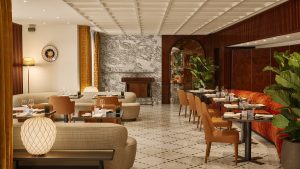 leather seats, wood clad walls and marble floors with diamond pattern in restaurant in Bulgari roma