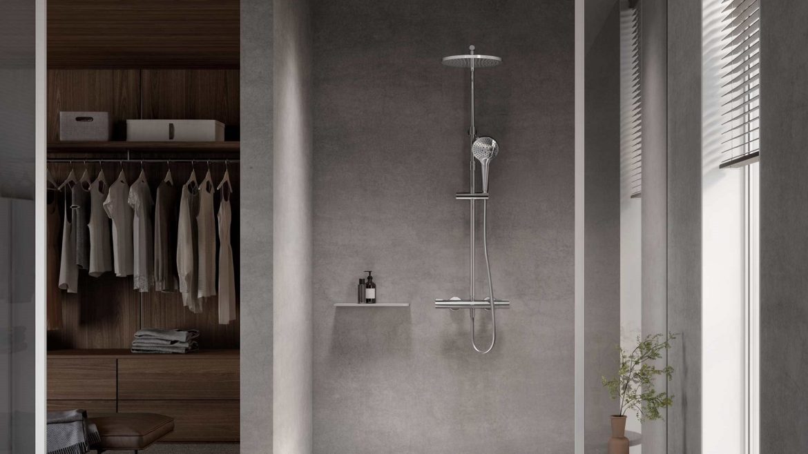 concrete grey shower room next to walk in wardrobe with slimline showers by KEUCO PLAN blue range