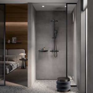 black slimline KEUCO shower in concrete grey minimalist shower room in the bedroom