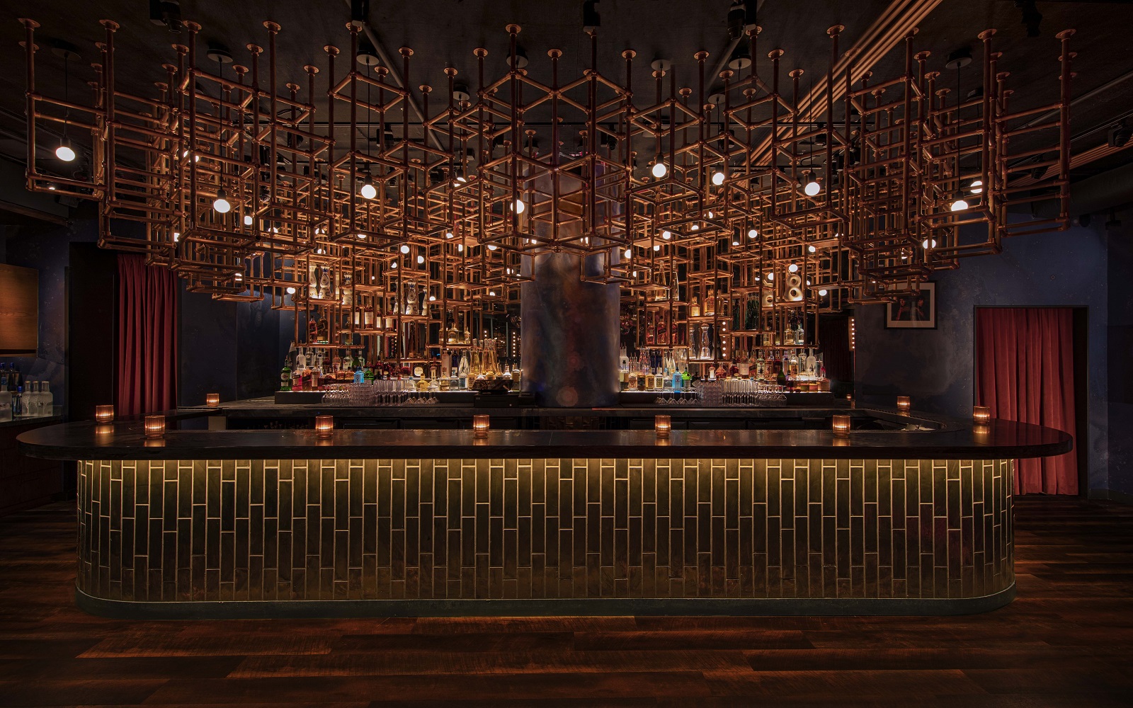 statement structural grid lighting feature above the bar in Loosies Bar in Moxy Lower East side