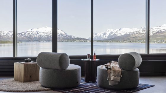 two round grey chairs facing out over an arctic view in Moxy Tromso