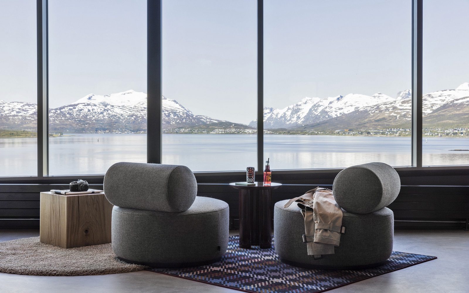 two round grey chairs facing out over an arctic view in Moxy Tromso
