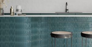 teal coloured vertical rectangle tiles on bar surface