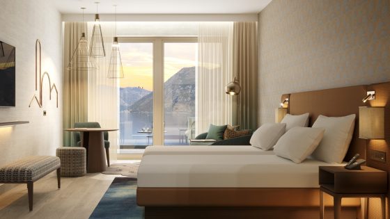 bed in hotel guestroom with view across the sea towards the mountains in Hyatt Regency Kotor Bay Resort