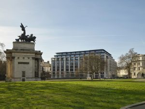 view across the park to the statue and The Peninsula London facade