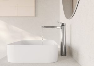 chrome tap turned on over white square basin with rounded edges 