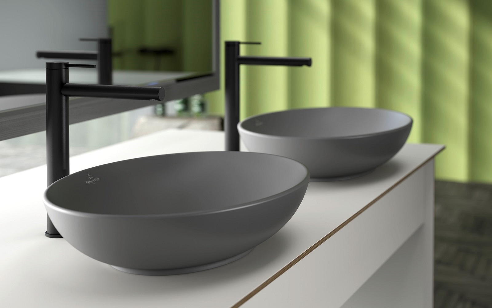 green background with grey handbasin and black tap from Villeroy & Boch Loop & Friends range