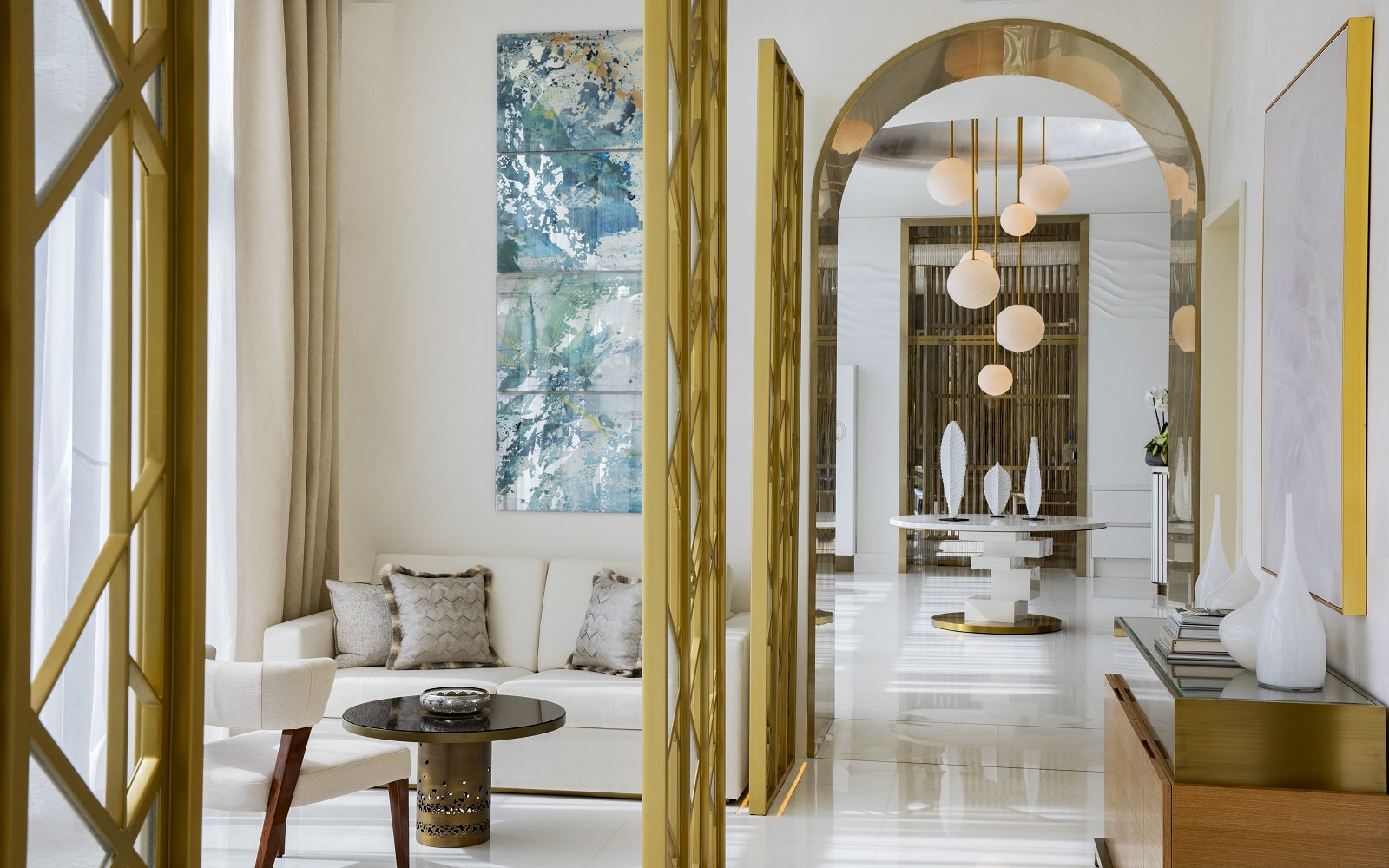 gold and white interior details in corridor leading into ESPA spa at Waldorf Astoria Lusail Doha