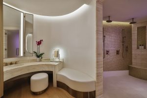 pearl like mosaic surfaces and organic curved edges reflect the light in the treatment rooms of Espa spa in Waldorf Astoria Doha 