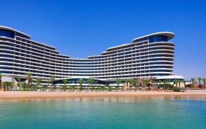 view of Waldorf Astoria Lusail doha from the sea across the beach
