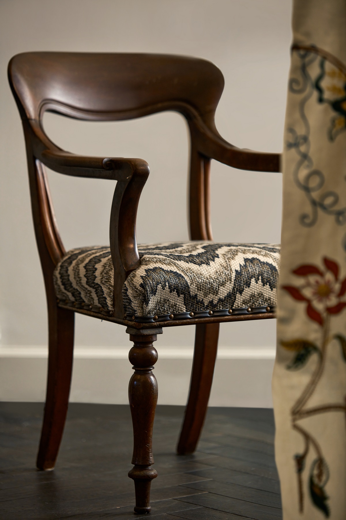 upholstered chair behind curtain edge all in fabric from Zoffany Arcadian Thames