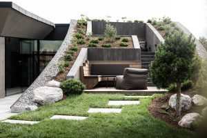 low level architecture with planted surfaces blend into the landscape