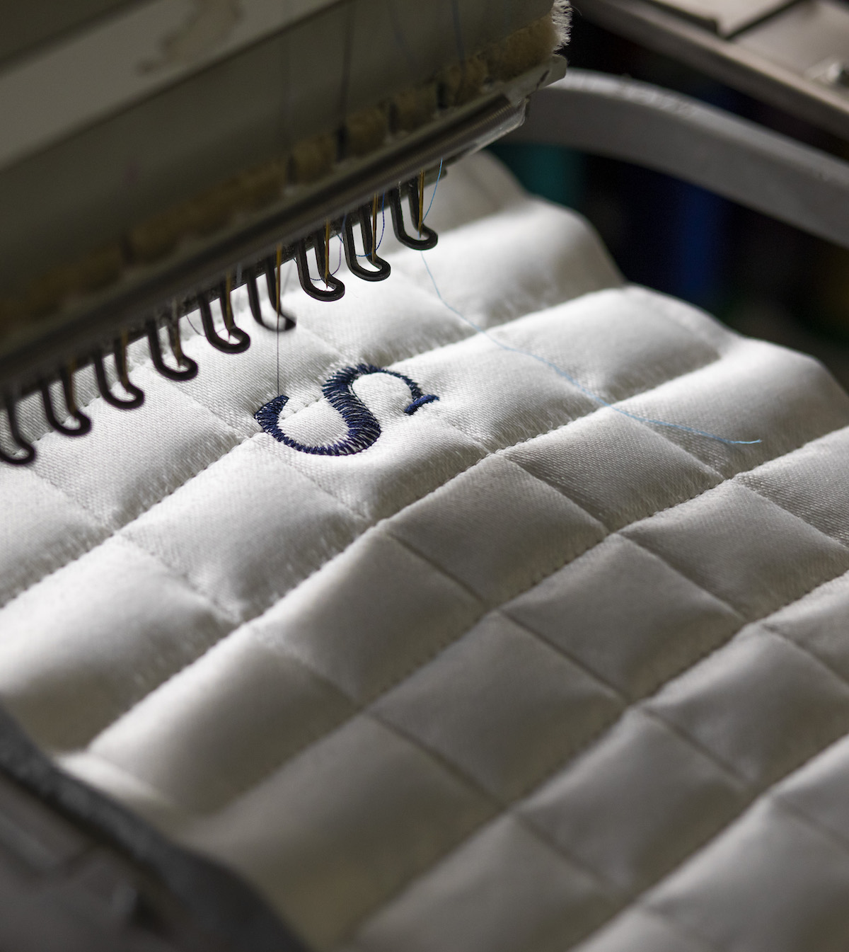 A close-up of stitching on mattress