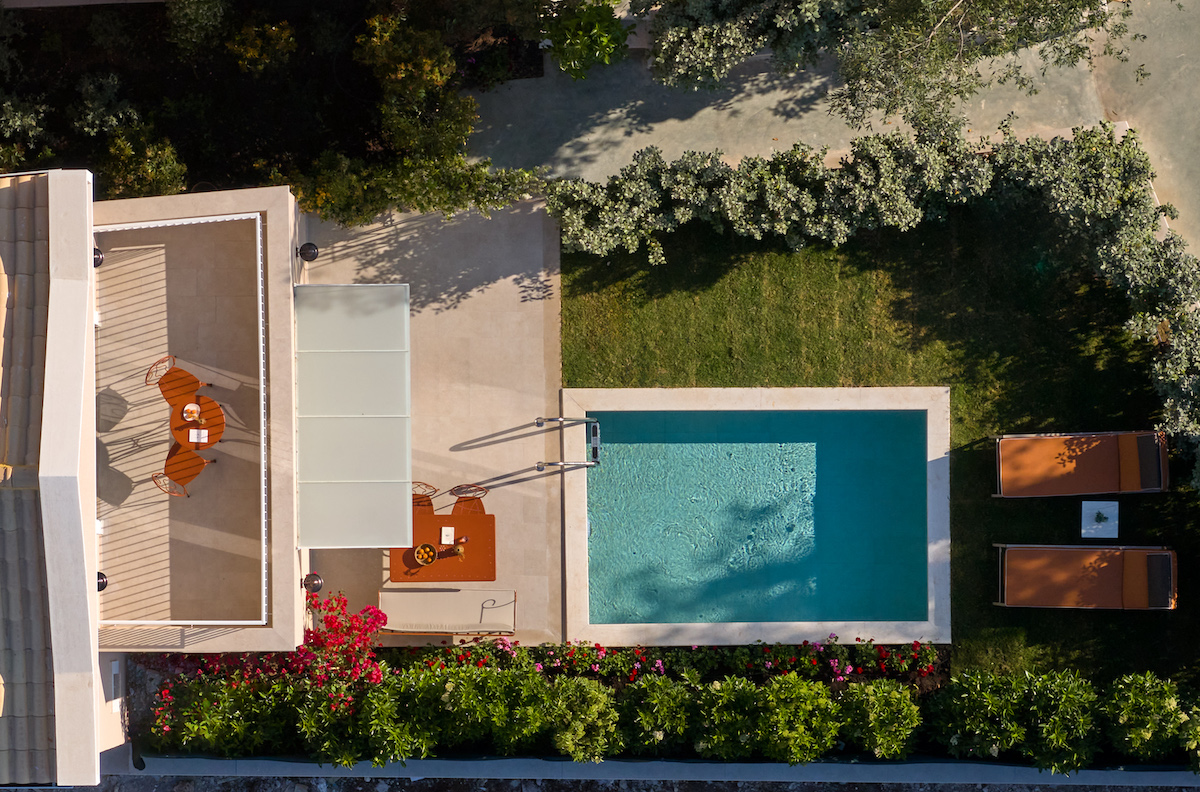 Arial view of modern villa with pool and garden