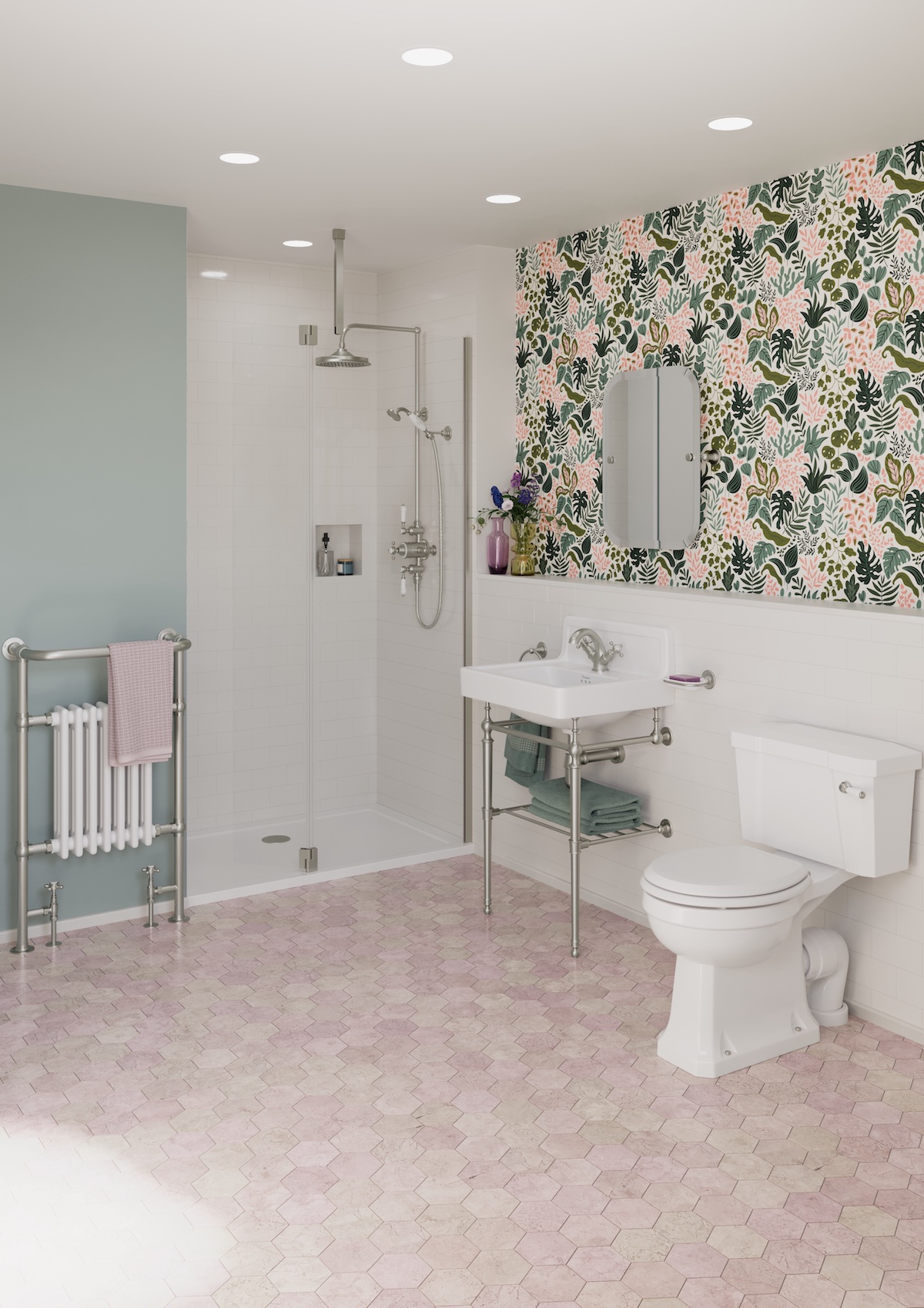A traditional bathroom with pink tiled floors and floral back wall