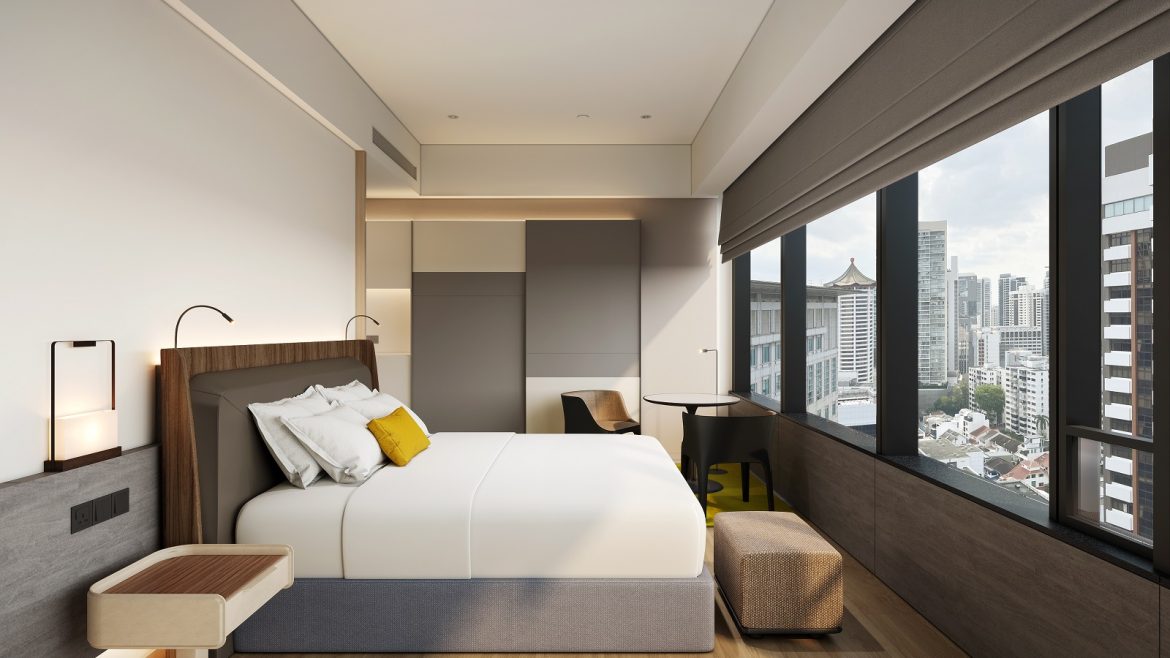 COMO Metropolitan Singapore hotel guestroom in grey and white with a yellow pillow on the bed and views across Singapore