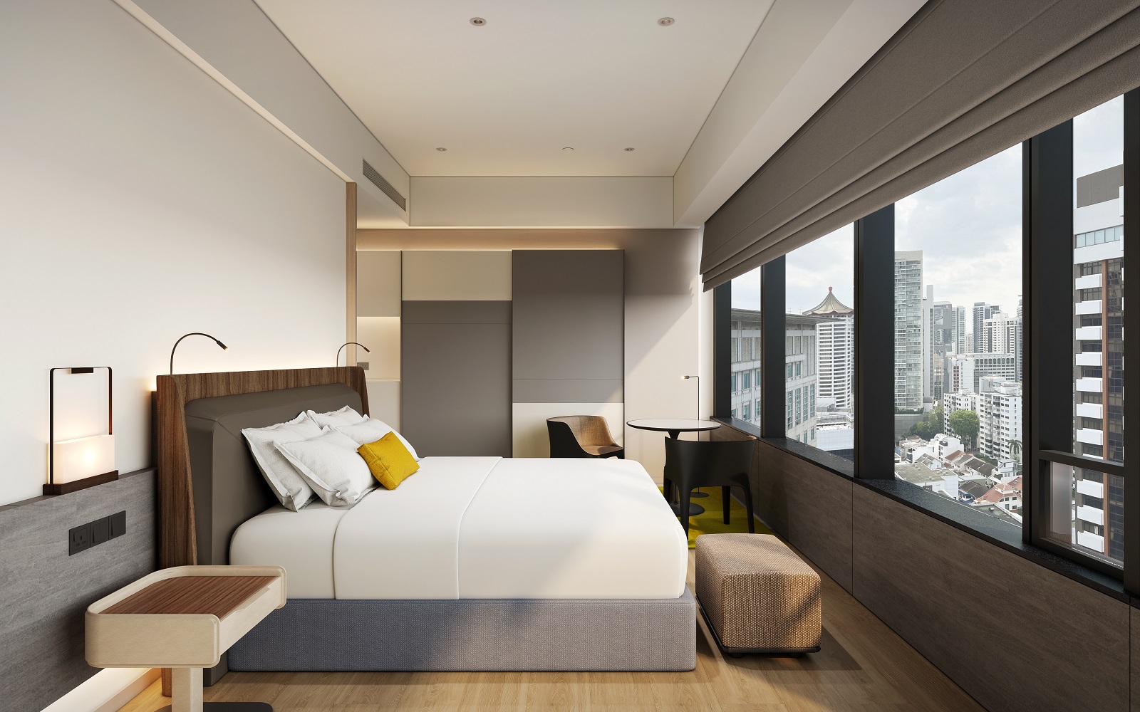 COMO Metropolitan Singapore hotel guestroom in grey and white with a yellow pillow on the bed and views across Singapore