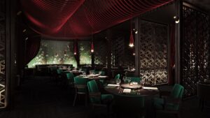 dark and moody interior of Duck Laundry restaurant with red draped ceiling and embroidered oriental screen