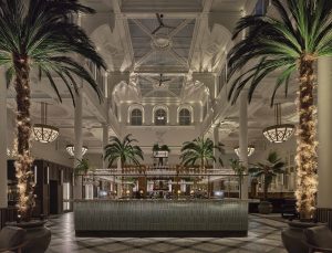 colonial arches, vaulted ceilings and palm trees in the lobby at The Municipal in Liverpool