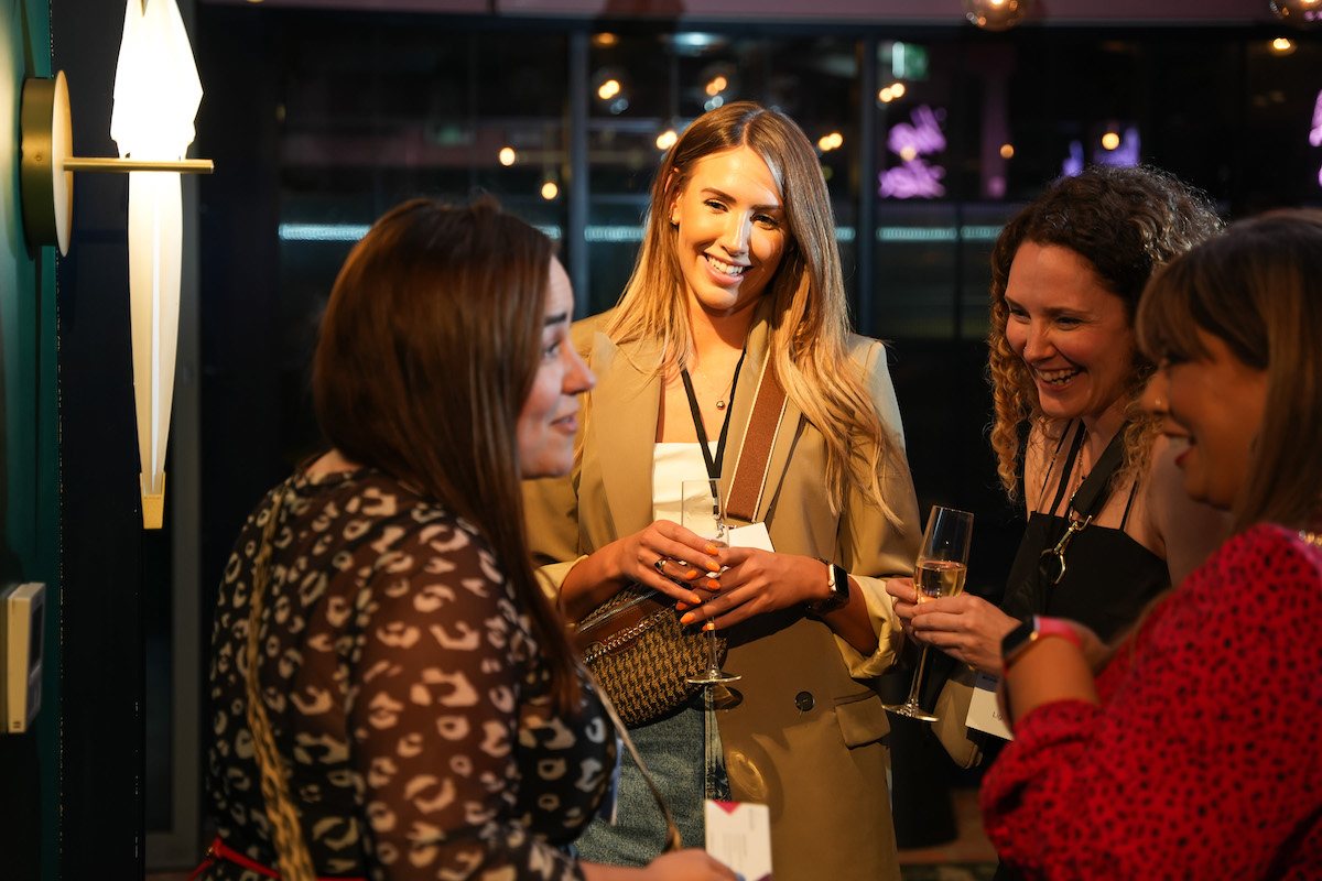 Woman smiling at networking event in Manchester
