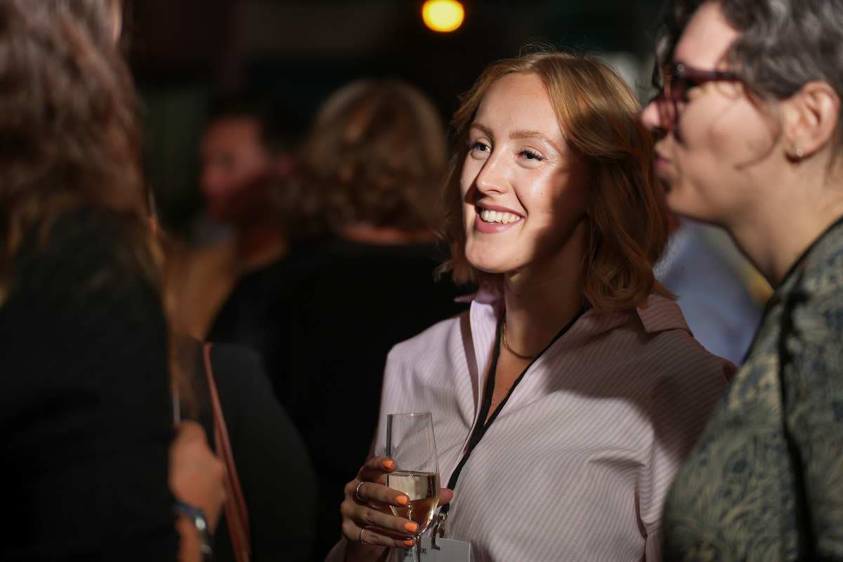 Woman at networking event in Manchester laughing