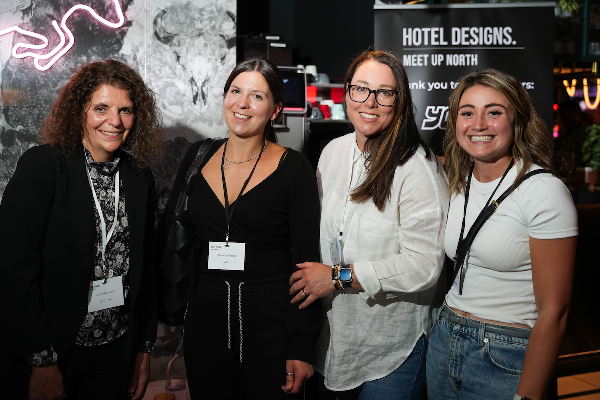 Four women smiling for camera at Hotel Designs networking event