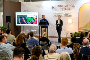 audience and speakers on the Innovation Stage at the IHS 2022