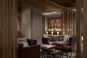 soft lighting and neutral colours in wood and leather in the seating in bar of Ritz-Carlton Naples