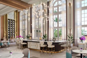 High ceilings, arched double volume windows with seating around the Lobby Bar in the Ritz-Carlton Naples