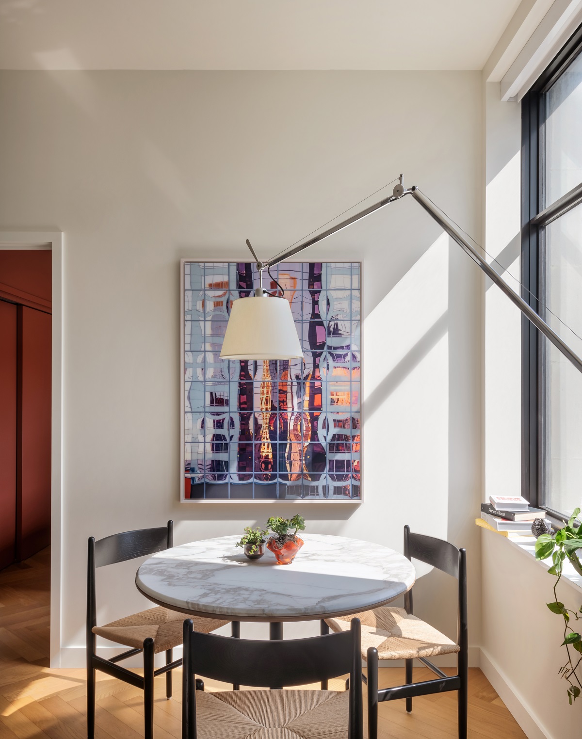 large anglepoise floor lamp in front of round dining table in ROOST Detroit
