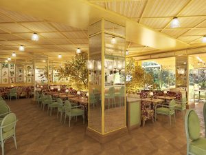 light, bright yellow and green and wicker interior in the restaurant at La Fantaisie in Paris with doors leading onto gardens