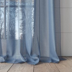 sheer blue curtain falling onto wooden floor in fabric collection Savvy from Sekers