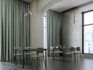 grey floor to ceiling curtains in industrial style setting with tables and chairs and windows looking out over the city