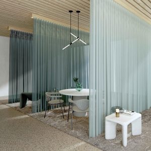 softly draping Stylo fabric from Sekers divides interior space into sections for seating