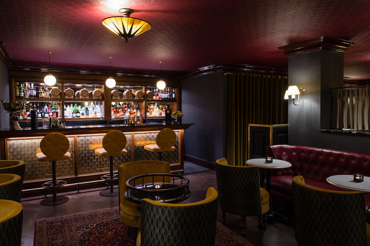 A dark and moody underground bar at hotel in London