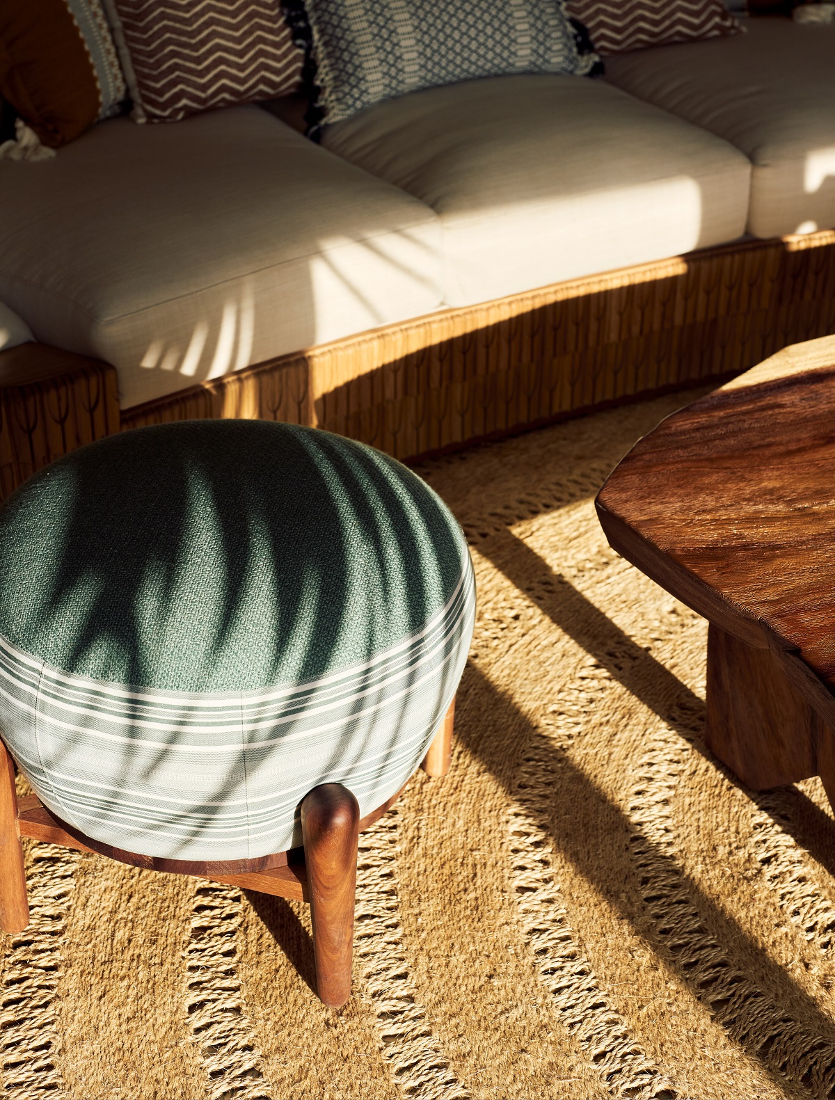 detail of small upholstered stool and woven jute carpet for the Maroma hotel by local artisans