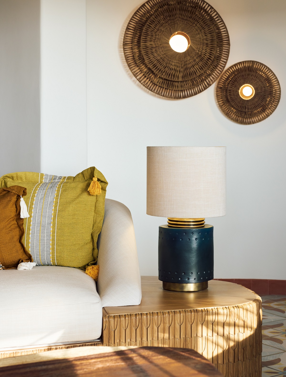woven details on the wall, ceramic lampbase and handwoven cushion detials on a couch in Maroma hotel Riviera Maya