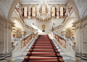 OWO Grand Staircase with red carpet inside Raffles London