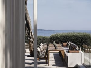 outdoor restaurant and seating on Corfu with tiled floor and seating with views across the sea