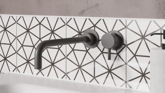 black and white patterned tile splashback behind slate black wall mounted tap from Crosswater