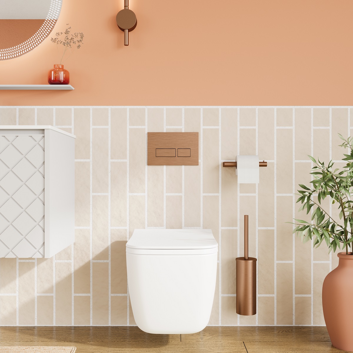 wall hung toilet in bathroom with peach and beige walls and brass accessories