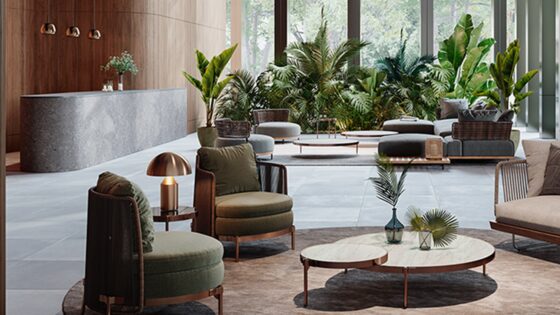 seating centred on a round carpet with hotel reception desk and plants in the background