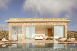 stone villa with double glass doors opening onto private pool in La Fiermontina Ocean Moroccco