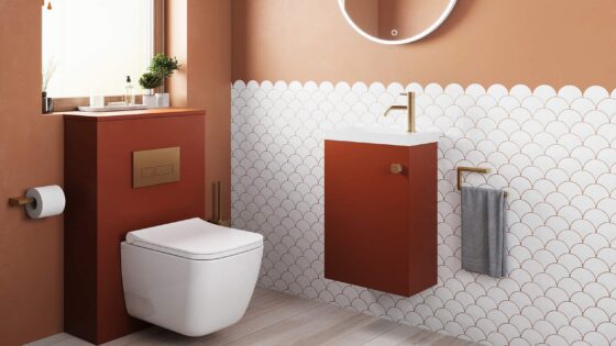 white scalloped tiles adjacent to terracotta wall with ALO cloakroom wall hung basin white with a dark terracotta cupboard