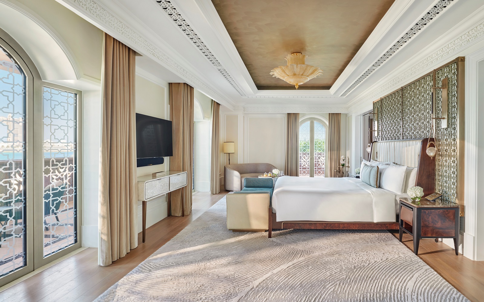gold and cream and marble finishes in the guestroom with a seaview in Emirates Palace Mandarin Oriental By Champalimaud Design