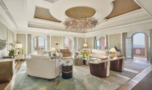 cream furniture with gold accents and statement chandelier on Mandarin Oriental emirates royal suite