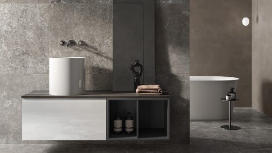bathroom with marble tiled walls and wall hung furniture and fittings from the RAK petit range